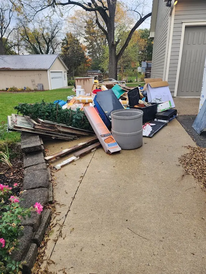 Dumpster being loaded with debris for Demolition Dumpster Rental in Bayonne